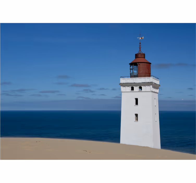 Fotobehang bergen vuurtoren bij de oceaan - TenStickers