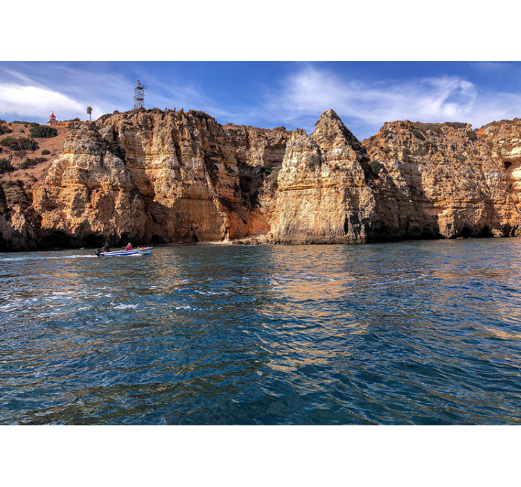 Rotsstructuur aan zee fototapet landschap - TenStickers