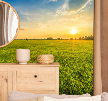 Fototapet landschap zonsondergang boven groene velden - TenStickers