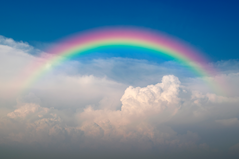 Poster met regenboog wolken - TenStickers