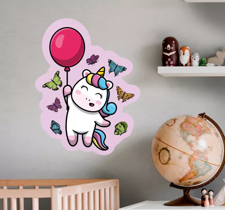 Speelse eenhoorn met ballon muursticker kinderkamer - TenStickers